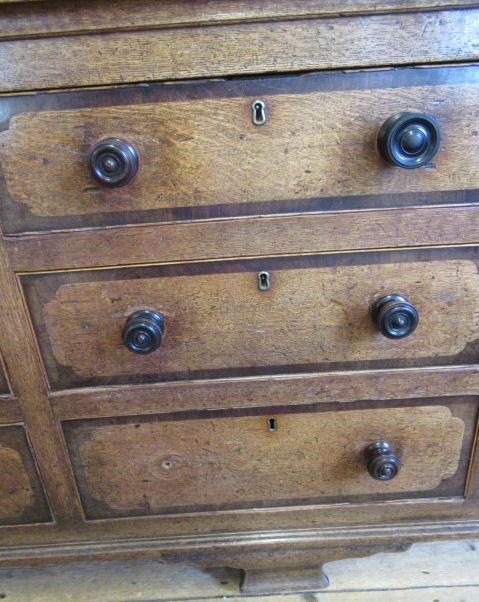 A LARGE GEORGIAN OAK AND MAHOGANY BANDED HOUSEKEEPERS CUPBOARD Image