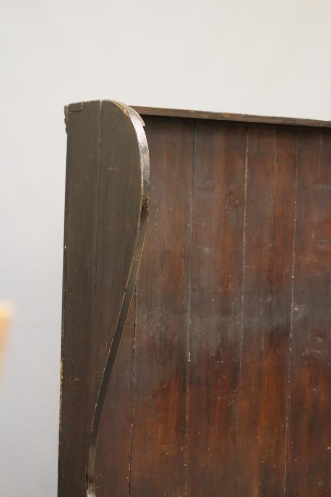 A STAINED PINE WING BACK TAVERN SETTLE, 19th century, with high boarded back, plank seat with Image