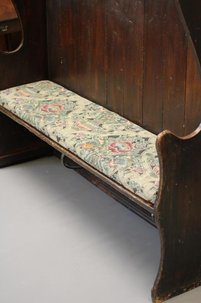A STAINED PINE WING BACK TAVERN SETTLE, 19th century, with high boarded back, plank seat with Image