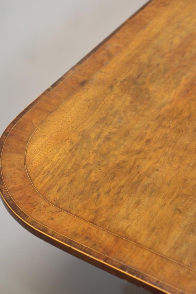 A REGENCY 'PLUM PUDDING' MAHOGANY BREAKFAST TABLE Image