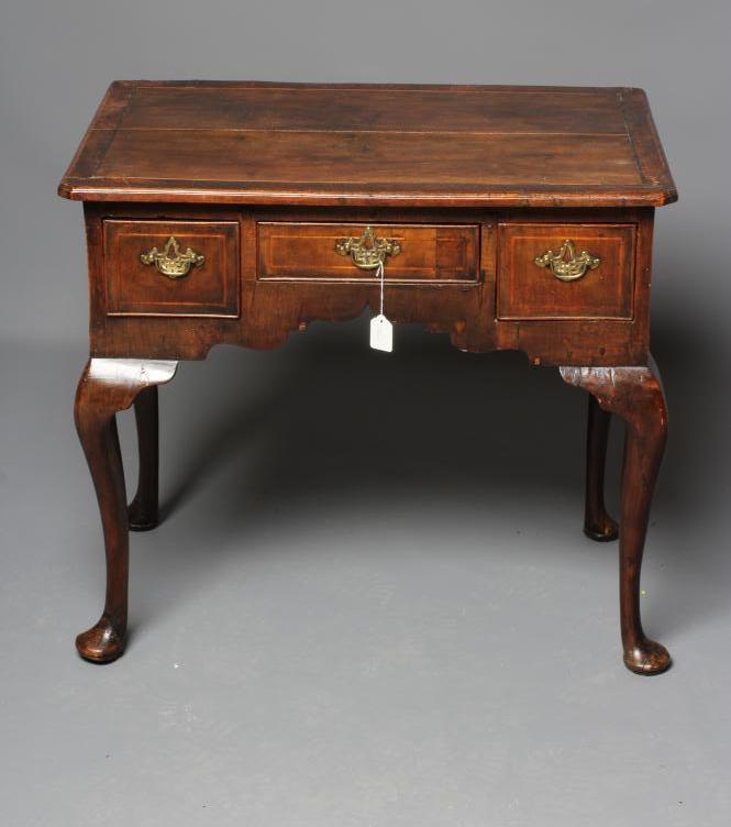 A GEORGIAN WALNUT LOWBOY Image