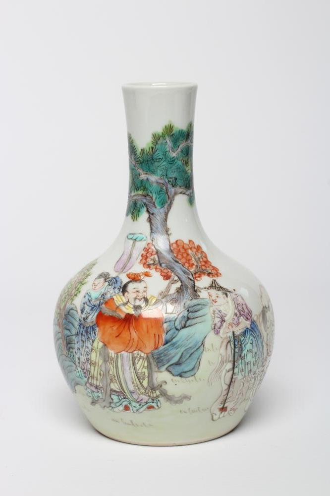 A CHINESE PORCELAIN BOTTLE VASE painted in colours with a vignette of three figures below a gnarled Image