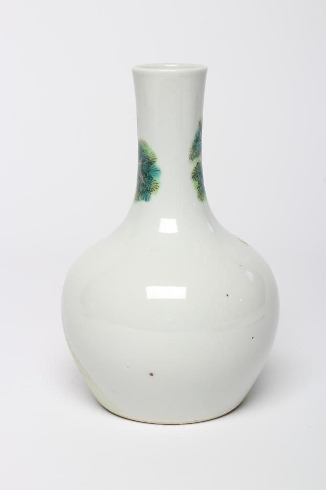 A CHINESE PORCELAIN BOTTLE VASE painted in colours with a vignette of three figures below a gnarled Image