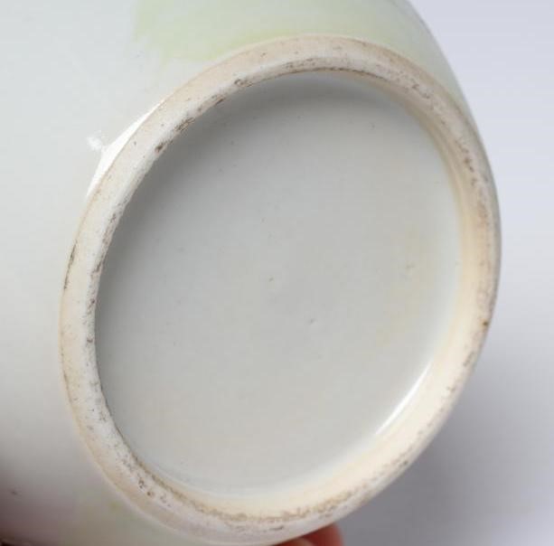 A CHINESE PORCELAIN BOTTLE VASE painted in colours with a vignette of three figures below a gnarled Image