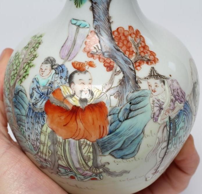 A CHINESE PORCELAIN BOTTLE VASE painted in colours with a vignette of three figures below a gnarled Image