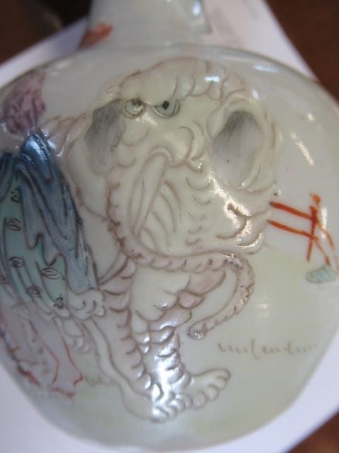 A CHINESE PORCELAIN BOTTLE VASE painted in colours with a vignette of three figures below a gnarled Image