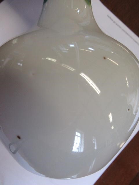 A CHINESE PORCELAIN BOTTLE VASE painted in colours with a vignette of three figures below a gnarled Image