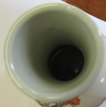 A CHINESE PORCELAIN BOTTLE VASE painted in colours with a vignette of three figures below a gnarled Image