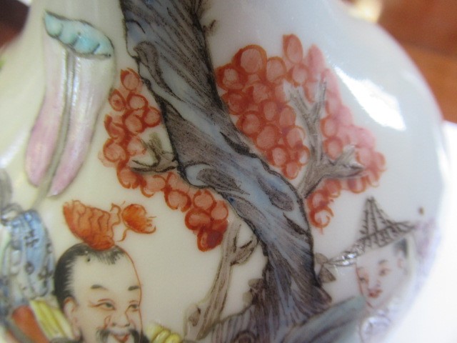 A CHINESE PORCELAIN BOTTLE VASE painted in colours with a vignette of three figures below a gnarled Image