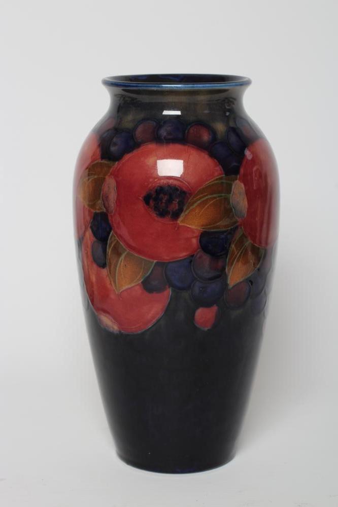 A MOORCROFT POTTERY POMEGRANATE PATTERN VASE, mid 20th century, of slender ovoid form, impressed, Image