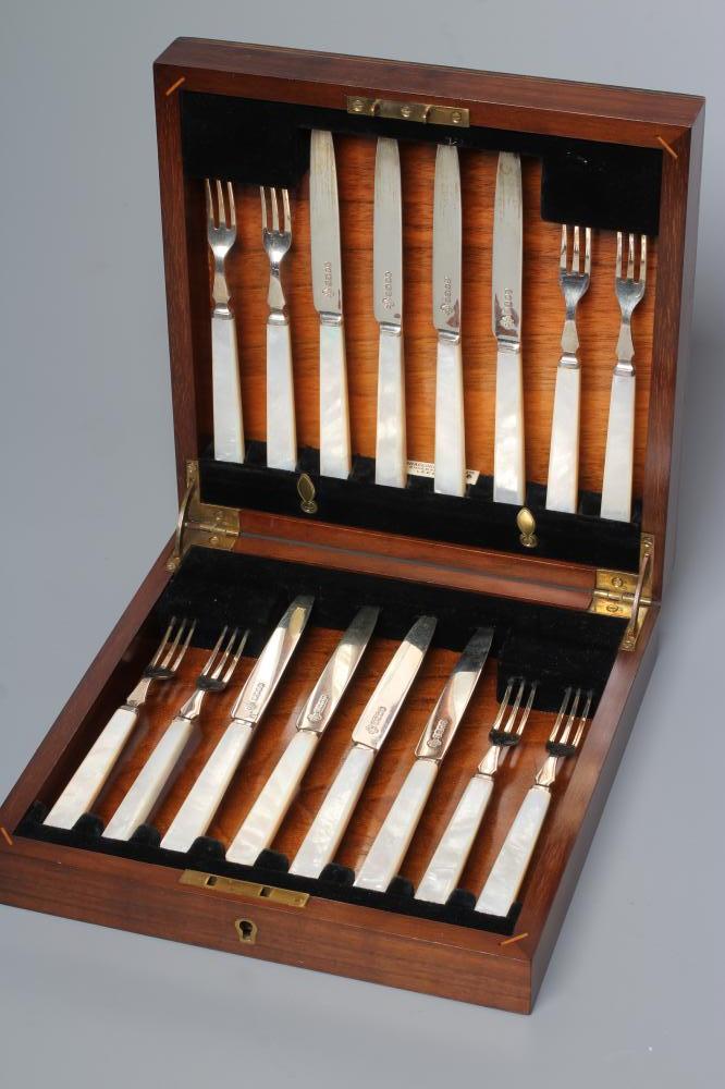 A SET OF EIGHT PAIRS OF SILVER FRUIT KNIVES AND FORKS Image