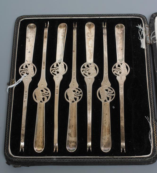 A SET OF SEVEN SILVER LOBSTER PICKS, by Frank Cobb, Sheffield 1928, of typical form centrally Image