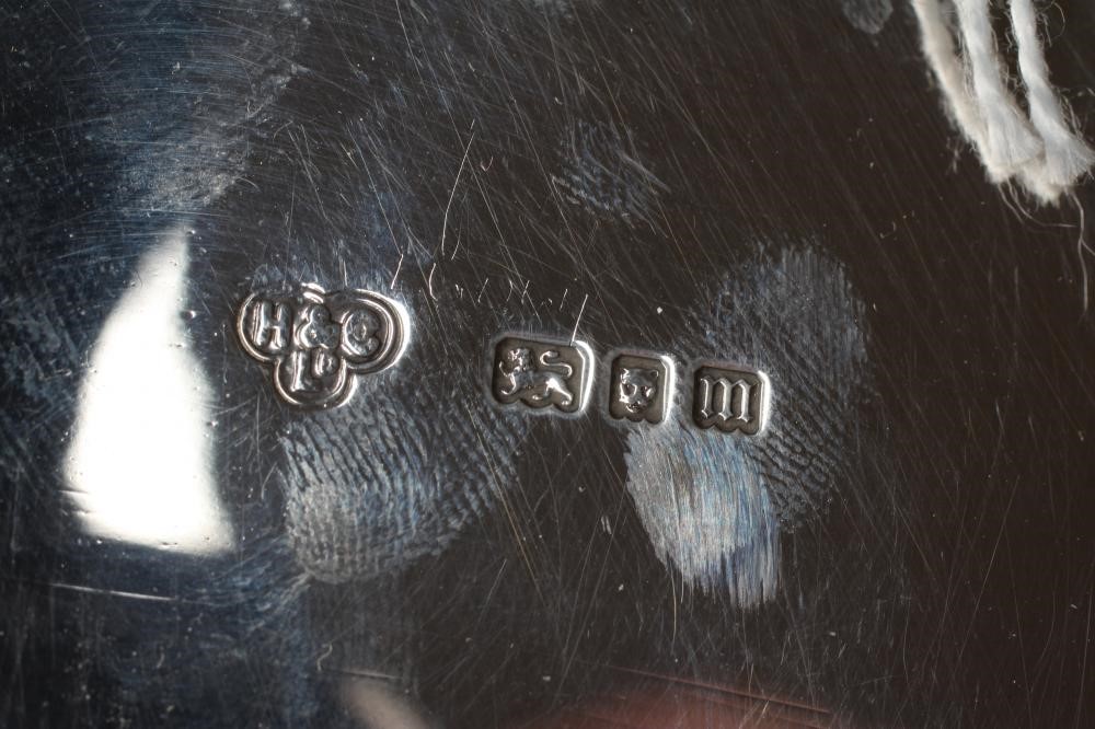 A SILVER SALVER, by Hamilton & Co., London 1927, of shaped circular form with piecrust rim, raised Image