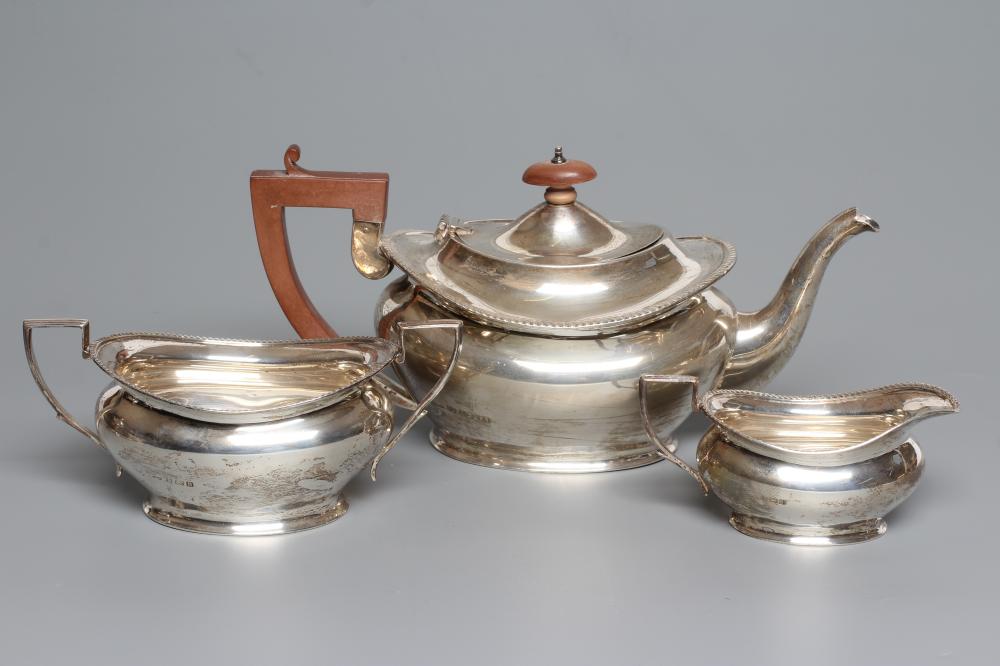 A SILVER THREE PIECE TEA SERVICE Image