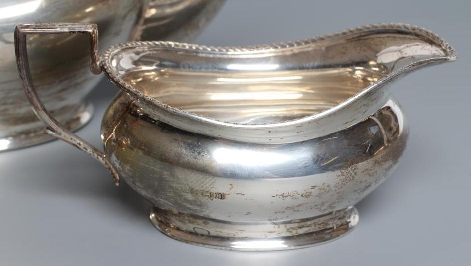 A SILVER THREE PIECE TEA SERVICE Image