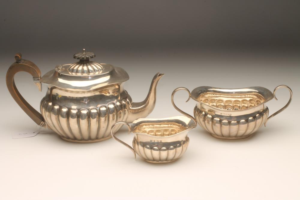 AN EDWARDIAN THREE PIECE SILVER TEA SERVICE Image