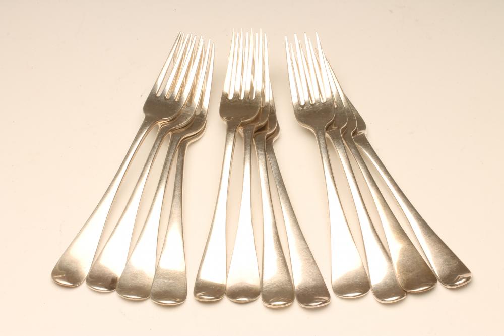 A SET OF NINE LATE GEORGE III SILVER TABLE FORKS Image