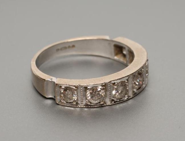 A SEVEN STONE DIAMOND HALF HOOP ETERNITY RING Image