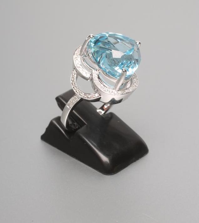 A BLUE TOPAZ AND DIAMOND COCKTAIL RING Image