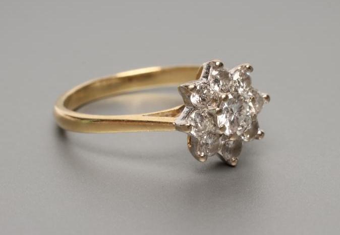 A NINE STONE DIAMOND CLUSTER RING Image