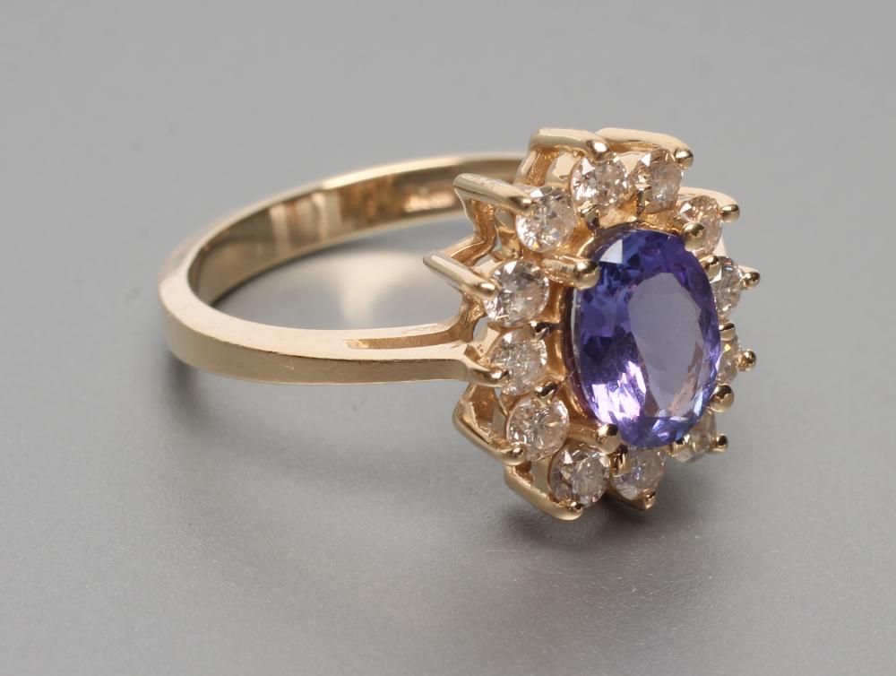 A TANZANITE AND DIAMOND CLUSTER RING Image