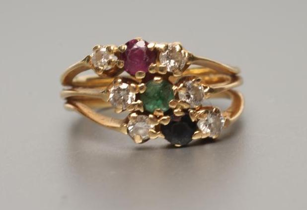 A MODERN MULTI-GEM SET TRIPLE BAND RING Image
