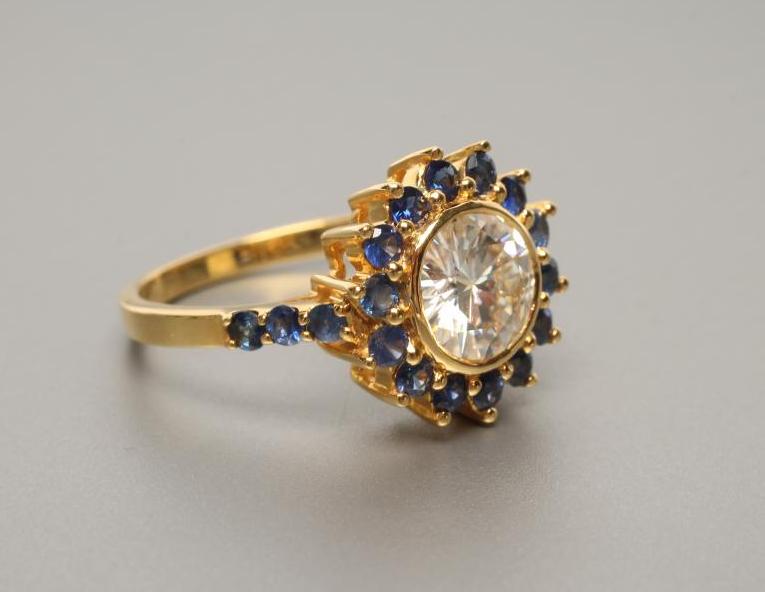 A MOISSANITE AND SAPPHIRE CLUSTER RING Image