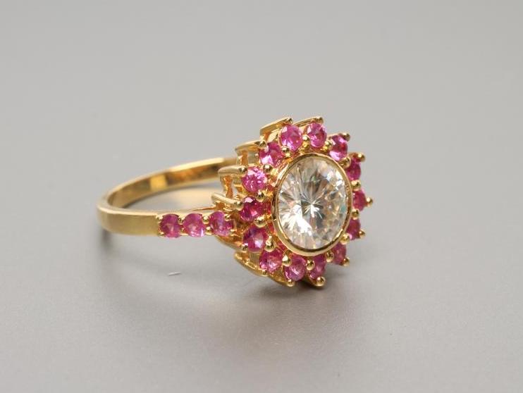 A MOISSANITE AND RUBY CLUSTER RING Image