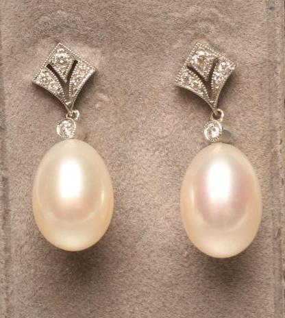 A PAIR OF PEARL DROP EAR STUDS Image