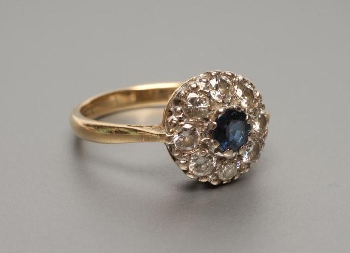 A SAPPHIRE AND DIAMOND CLUSTER RING Image