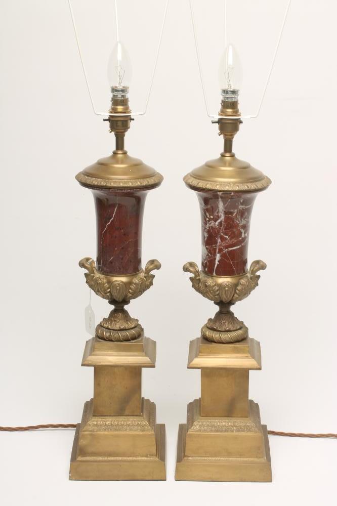 A PAIR OF BRASS AND ROUGE MARBLE TABLE LAMPS Image
