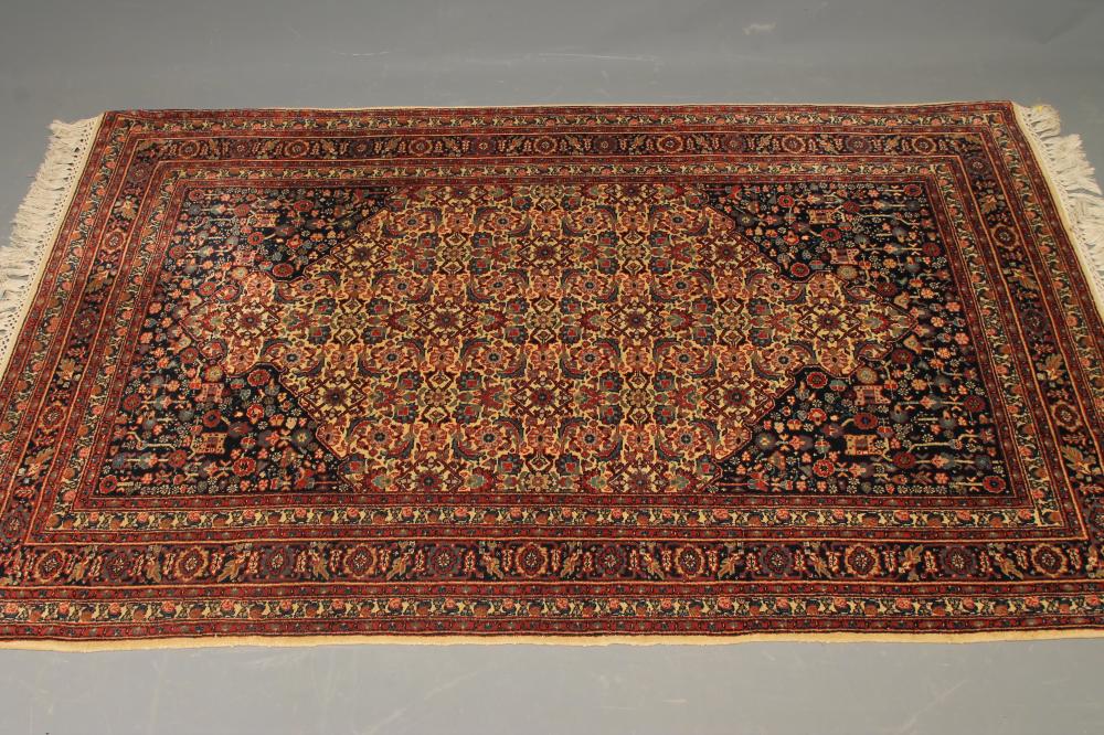 A PERSIAN HERATI PATTERN WOOL RUG Image