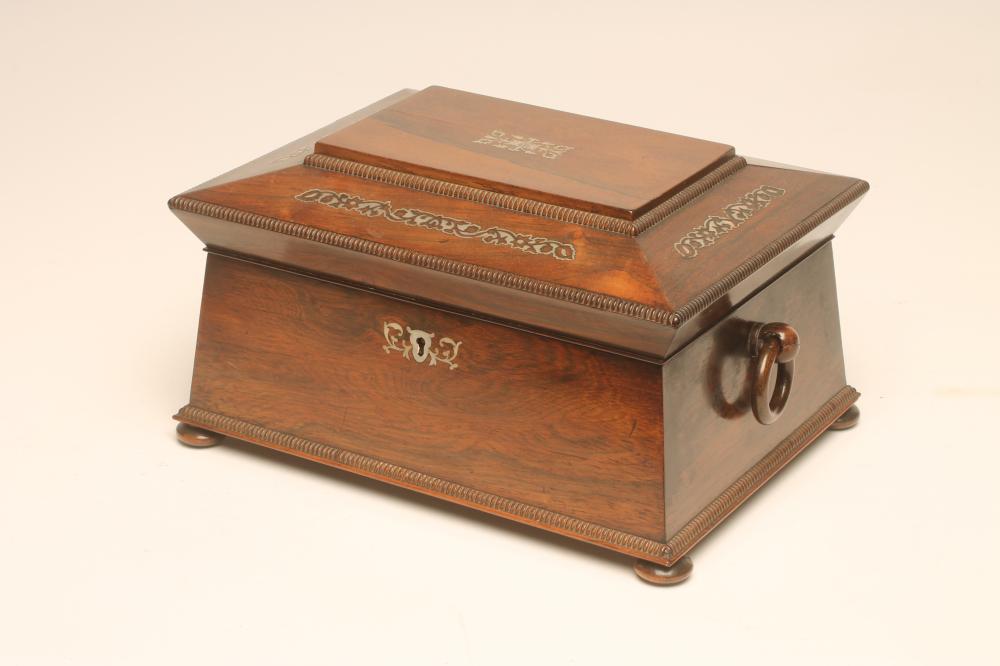 A VICTORIAN ROSEWOOD WORKBOX of sarcophagus form with reed edging and inlaid mother of pearl foliate Image