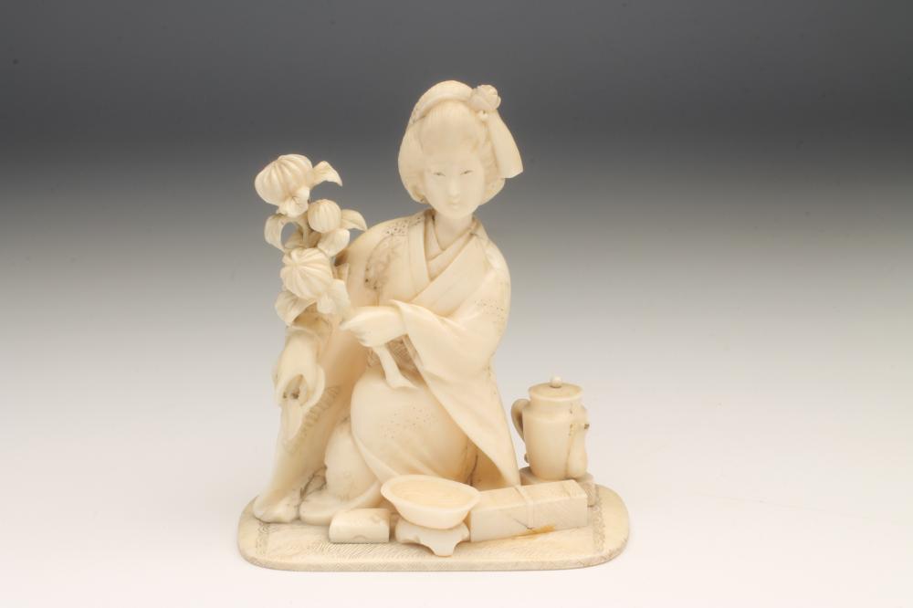 A JAPANESE IVORY FIGURE Image