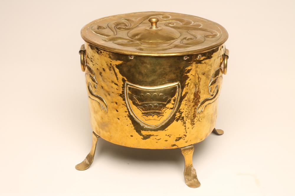 A JOHN PEARSON NEWLYN BRASS COAL BIN AND LIFT-OFF COVER Image