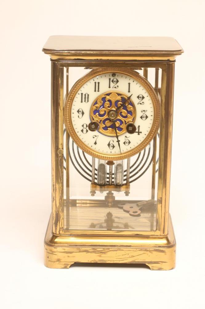 A BRASS CASED FOUR GLASS MANTEL CLOCK Image