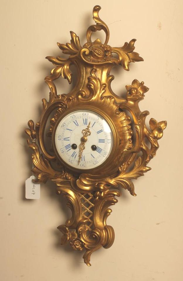 A FRENCH GILT BRONZE CARTEL CLOCK by John Freres Image