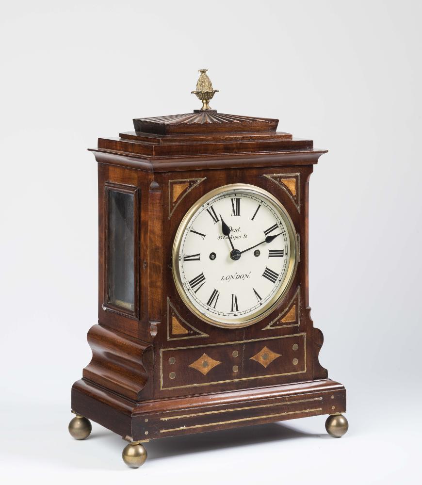A REGENCY MAHOGANY AND BRASS INLAID BRACKET CLOCK with a bell striking double chain and barrel fusee Image
