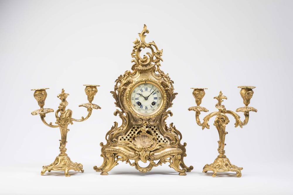 A FRENCH NEO-ROCOCO GILT BRONZE CLOCK GARNITURE Image