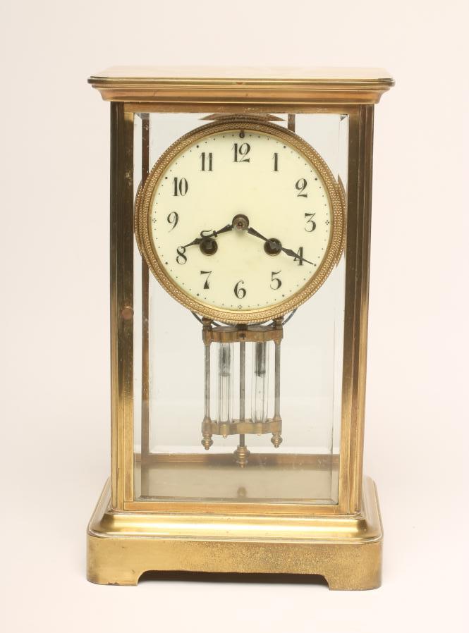 A FRENCH BRASS CASED FOUR GLASS MANTEL CLOCK Image