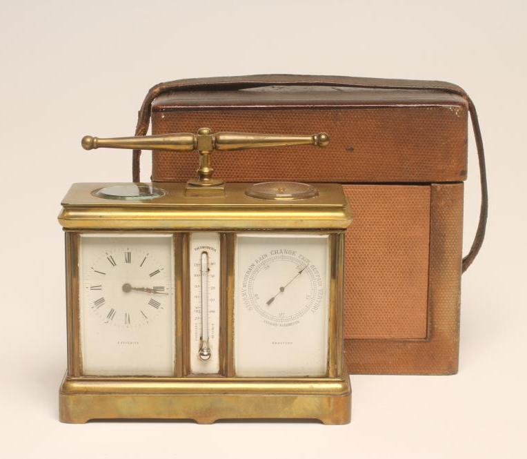 A BRASS CASED WEATHER STATION comprising a clock with platform escapement and white enamel dial with Image