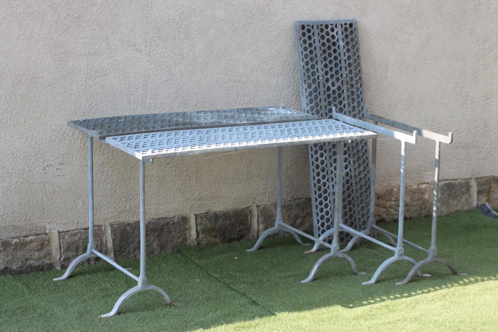 A PAIR OF GALVANISED IRON GREENHOUSE STANDS each comprising two oblong pierced honeycomb panels Image