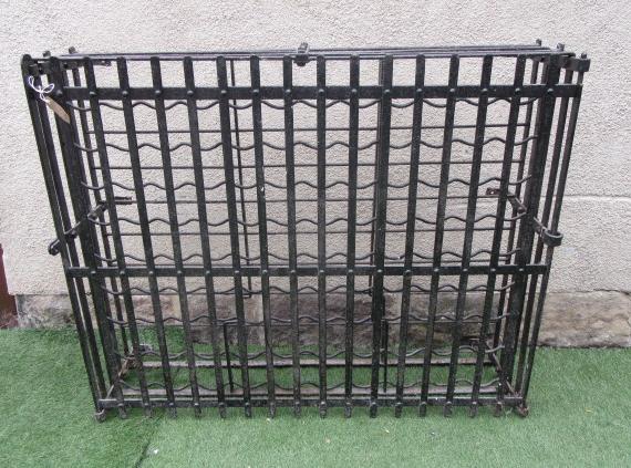 A CAST IRON WINE RACK Image