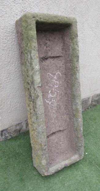 A SANDSTONE TROUGH of rough hewn oblong form Image