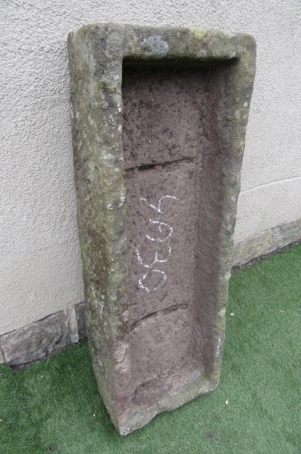 A SANDSTONE TROUGH of rough hewn oblong form Image