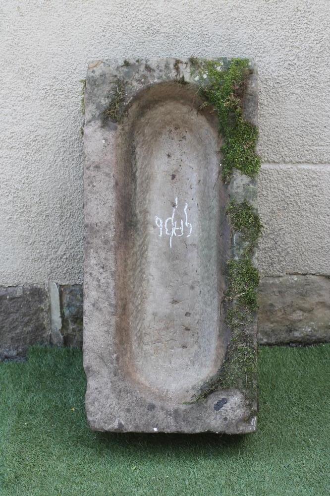 A SANDSTONE TROUGH of rough hewn oblong form Image