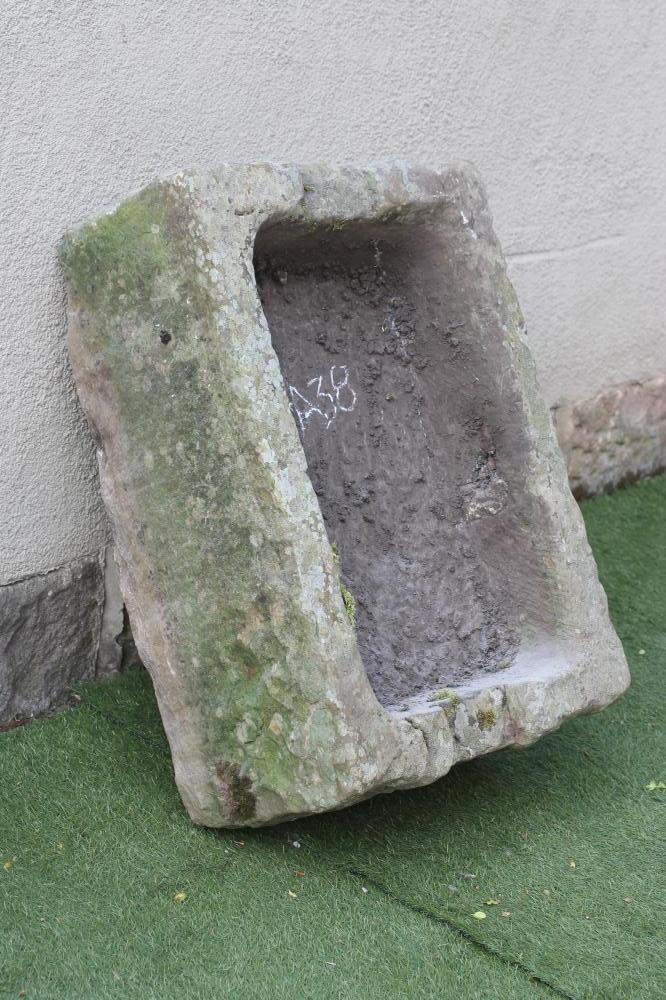 A SANDSTONE TROUGH of rough hewn oblong form Image
