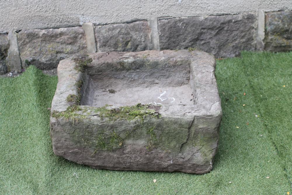 A SANDSTONE TROUGH of rough hewn oblong form Image