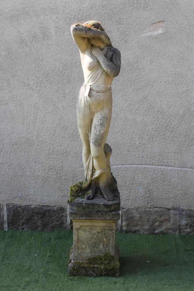 A COMPOSITION STONE FIGURE OF A CLASSICAL MAIDEN Image