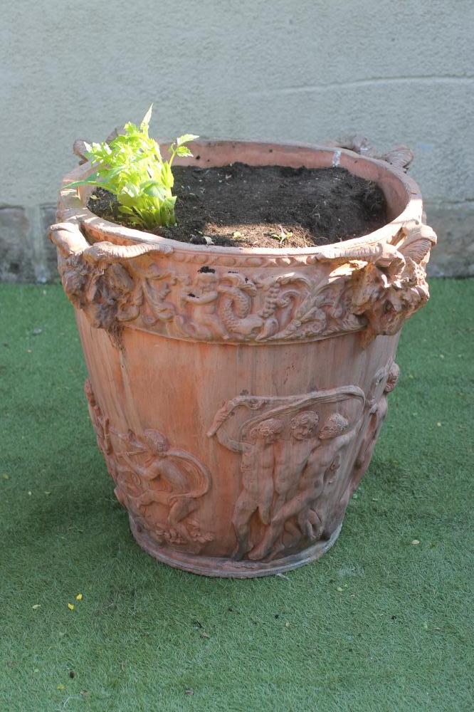 A LARGE ITALIAN STYLE TERRACOTTA POT of tapering form with satyr mask handles Image